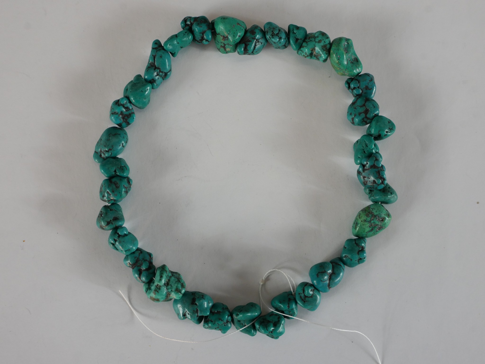 A collection of eight strings of turquoise chips, nuggets and polished round beads. 40cm longest - Image 5 of 7