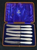 A cased set of six early 20th John Bradshaw & Sons mother of pearl handled butter knives, in