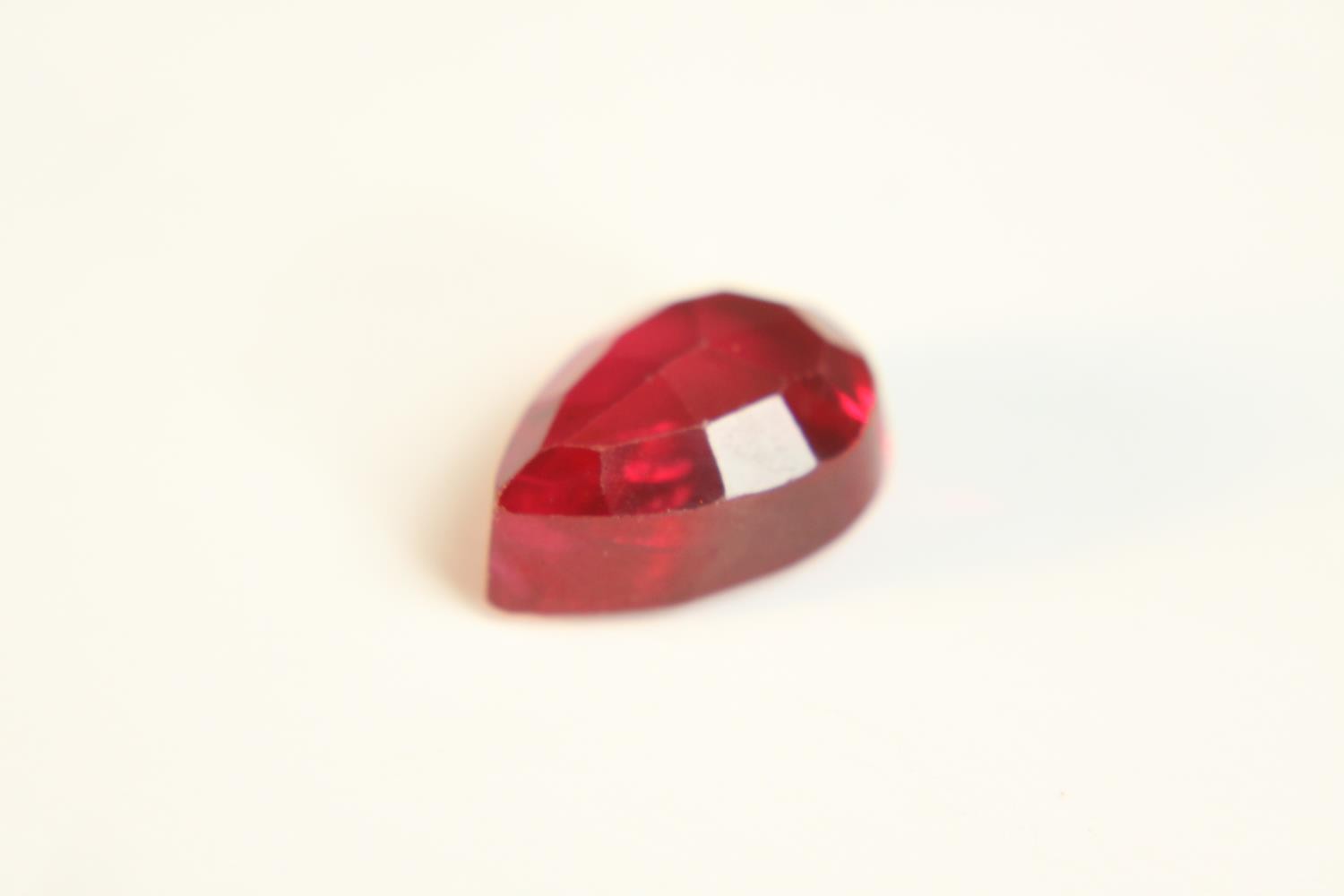 A 12.57 carat mixed cut pear shaped ruby. - Image 6 of 10