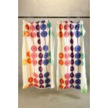 A pair of mid 20th century curtains with printed colourful circles decoration. L.160cm. (each)