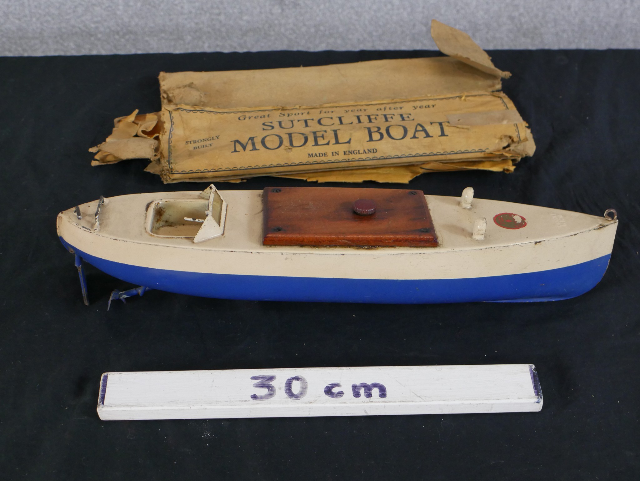A 20th century boxed Sutcliffe painted model boat. H.9 W.41 D.10cm - Image 2 of 3