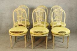 A set of six contemporary painted hardwood spoon and pierced splat back dining chairs raised on