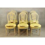 A set of six contemporary painted hardwood spoon and pierced splat back dining chairs raised on