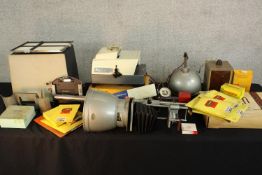 A large quantity of various film dark room equipment together with a boxed slide projector. H.28 W.