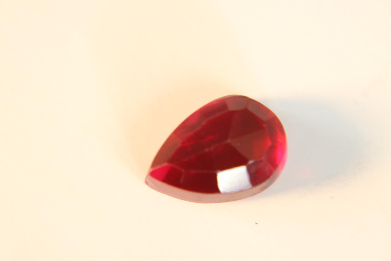 A 12.57 carat mixed cut pear shaped ruby. - Image 8 of 10
