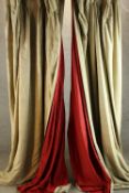A pair of gold and red velvet lined curtains. H.230cm. (each)