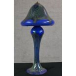 A 20th century Loetz style blue glass mushroom shaped table lamp, with iridescent abstract