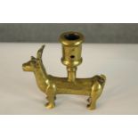 A German, possibly Medieval 15th century, small brass zoomorphic candleholder cast in the form of a