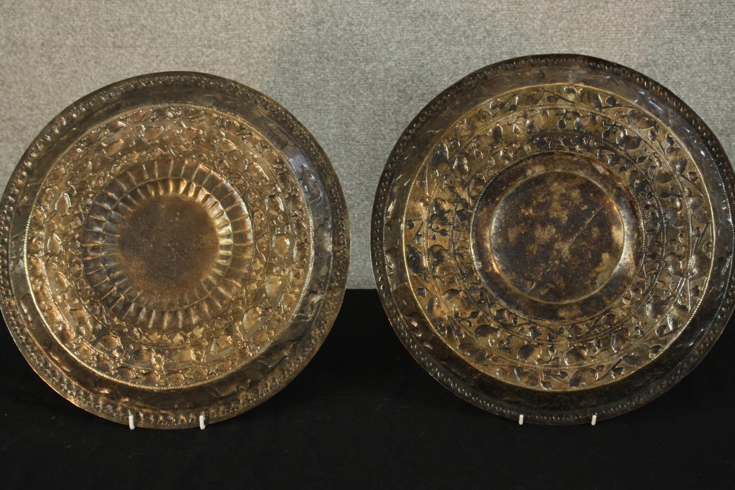 Two late 19th/early 20th, possibly Indian white embossed white metal chargers.. Dia.40cm. (each) - Image 3 of 3