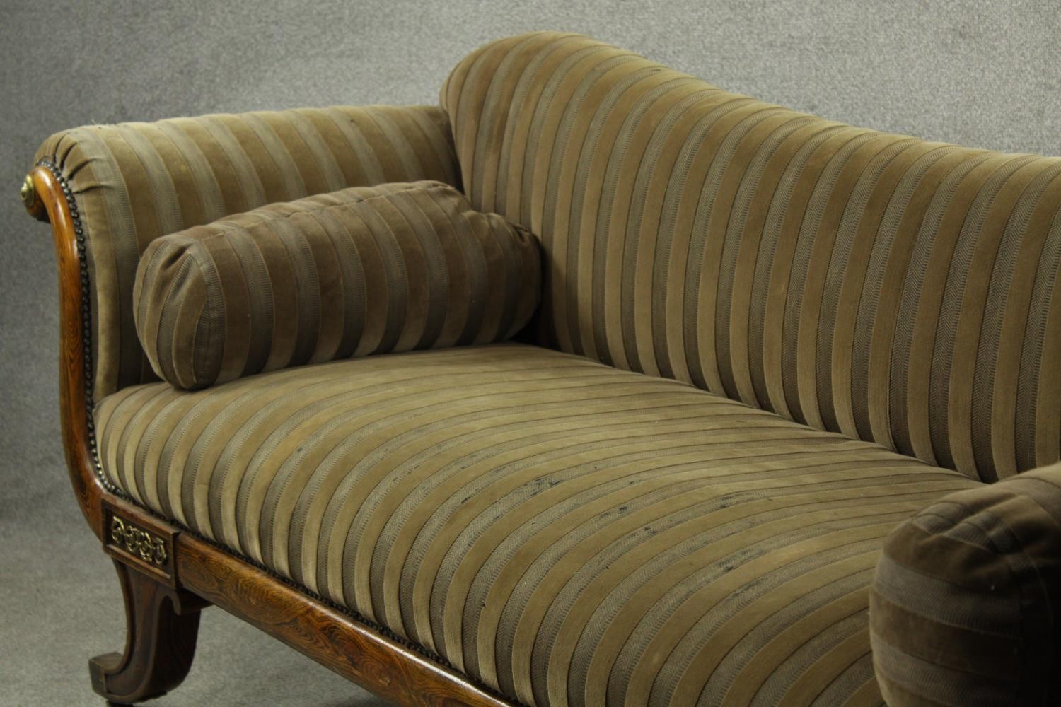 A Regency rosewood framed scroll arm settee upholstered in brown fabric, raised on four outswept - Image 9 of 10
