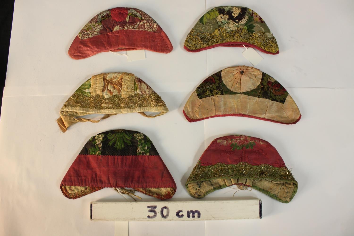 Six various 19th century silk stumpwork skull caps. L.20.cm. (largest) - Image 2 of 2