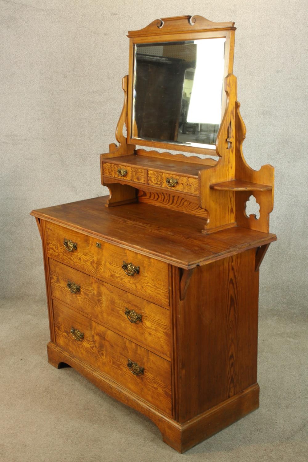 A late 19th/early 20th century pine mirror back dressing chest with three long drawers raised on - Image 4 of 4