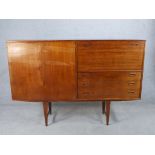 A mid 20th century Danish teak sideboard/drinks cabinet, with single cupboard drawers and drop