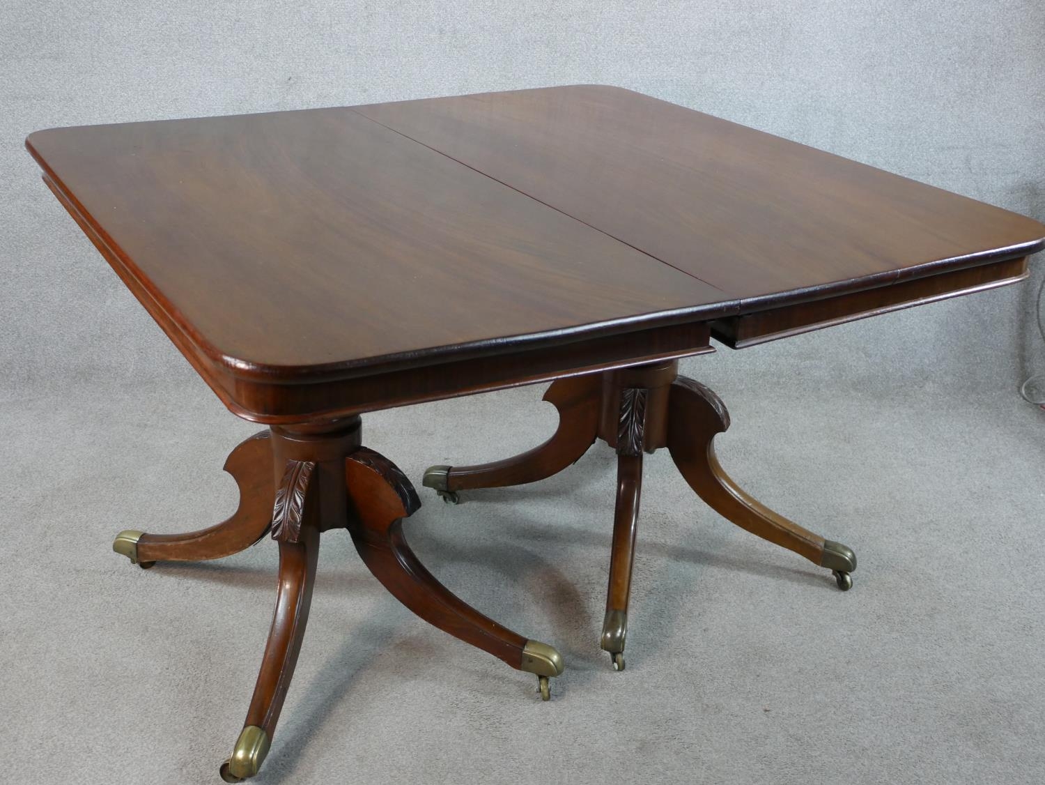 A Regency mahogany twin pedestal extending dining table raised on central turned column each with - Image 2 of 5