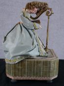 A 20th century Reuge of Switzerland musical automaton in the form of a lady playing the harp
