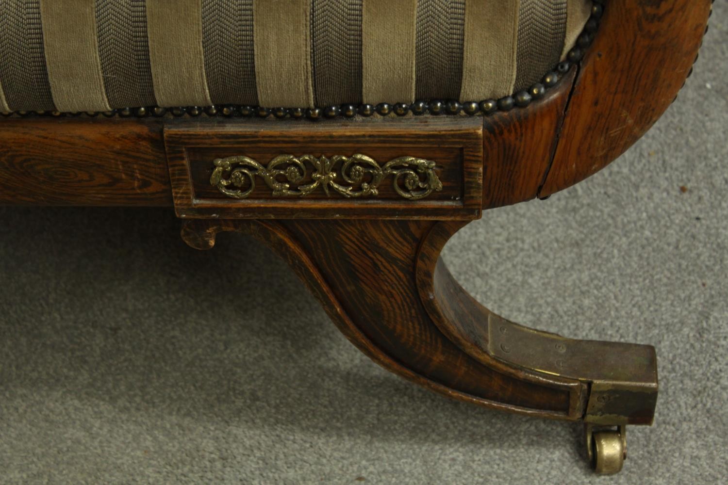 A Regency rosewood framed scroll arm settee upholstered in brown fabric, raised on four outswept - Image 6 of 10