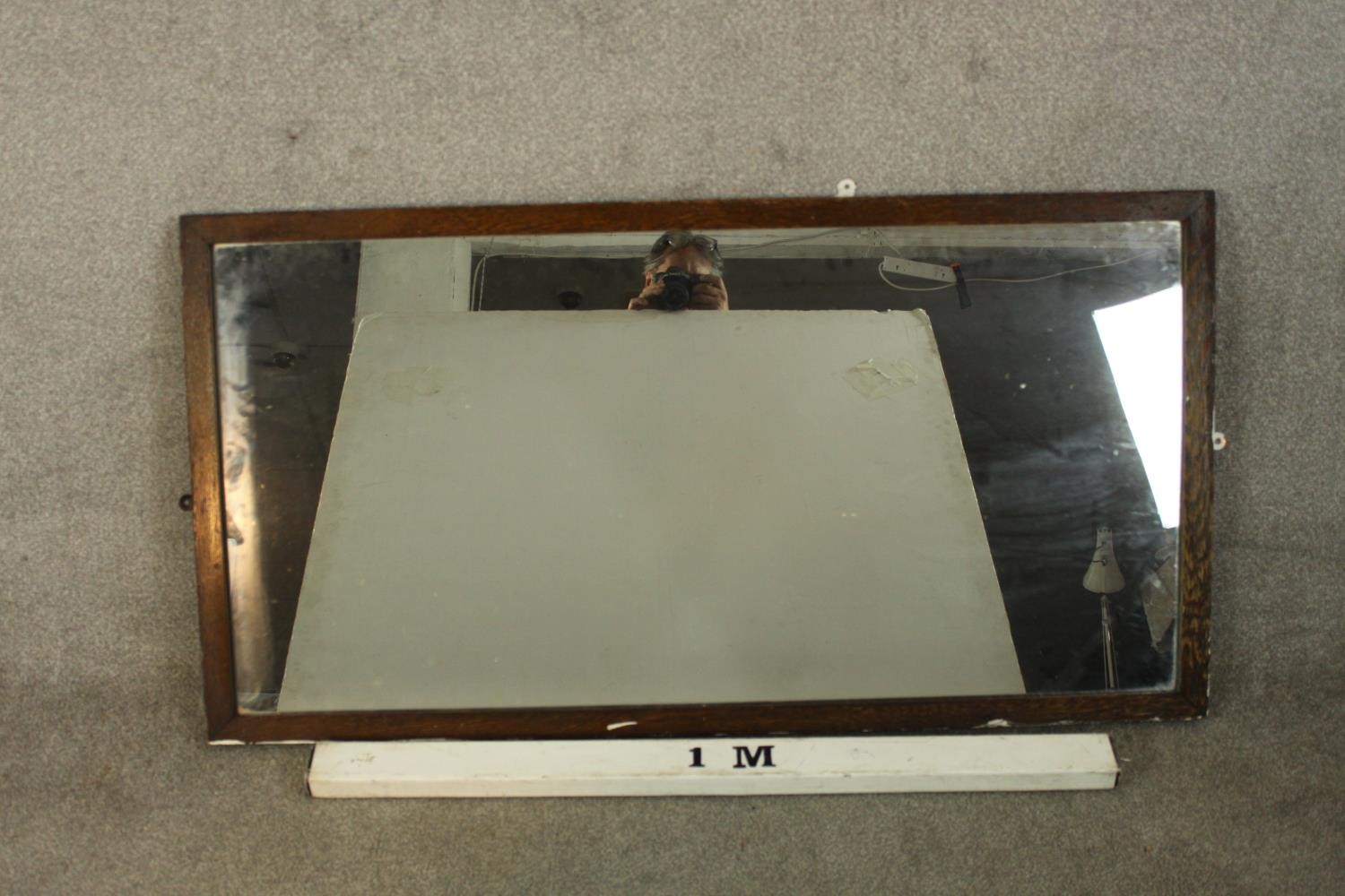 An early 20th century oak framed rectangular wall mirror. H.67 W.132cm. - Image 2 of 2