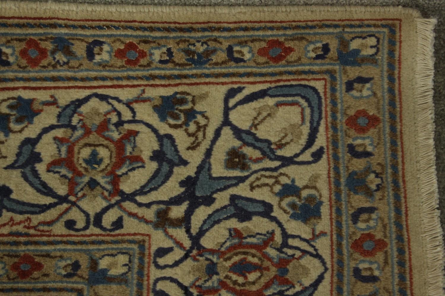 An 20th century Persian woollen carpet with all over floral and scroll decoration. L.203 W.194cm. - Image 4 of 5