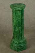 A painted malachite effect plaster fluted column raised on hexagonal shaped base. H.74cm.