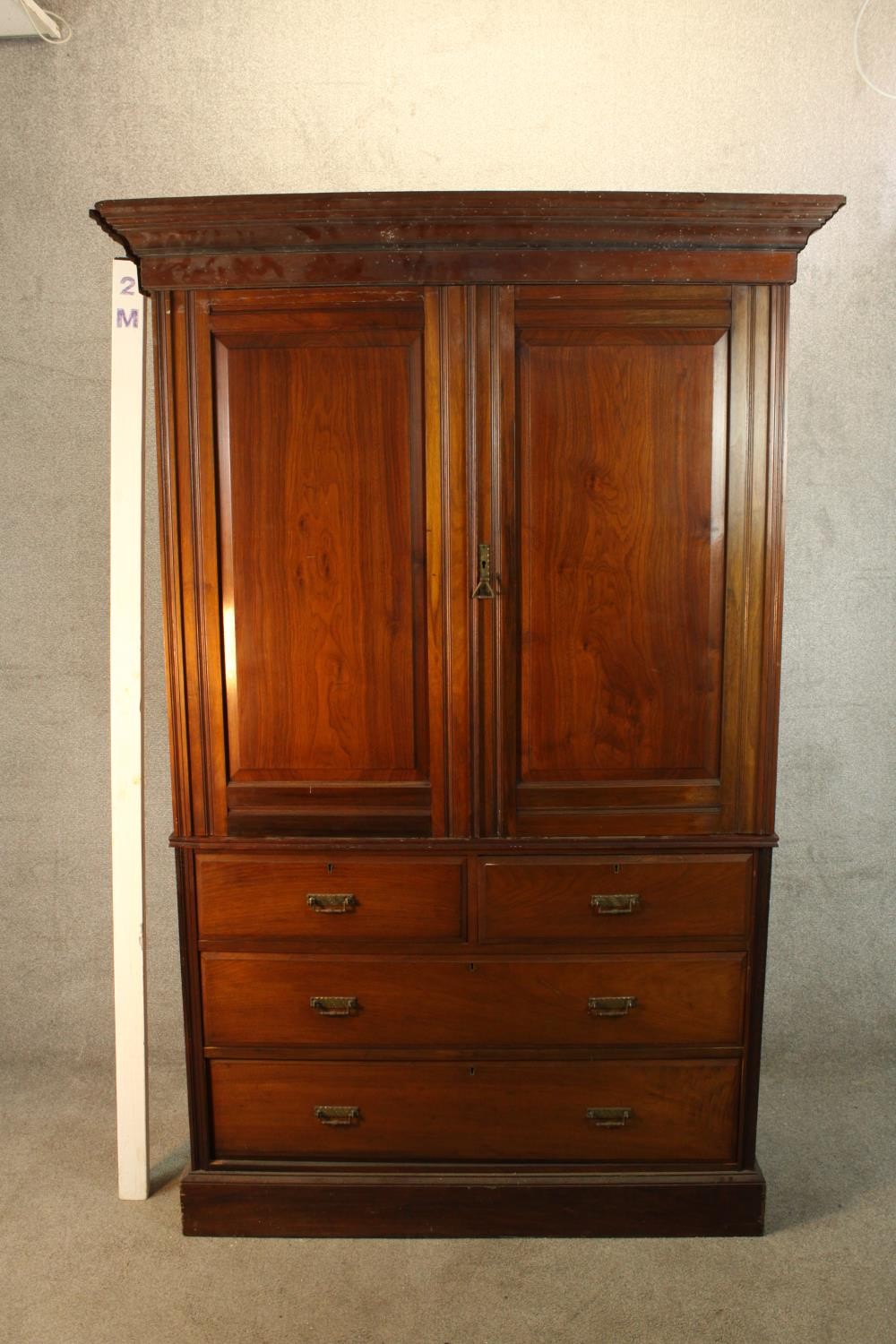 A 19th century mahogany twin door linen press opening to reveal three slides raised on two short - Image 2 of 6