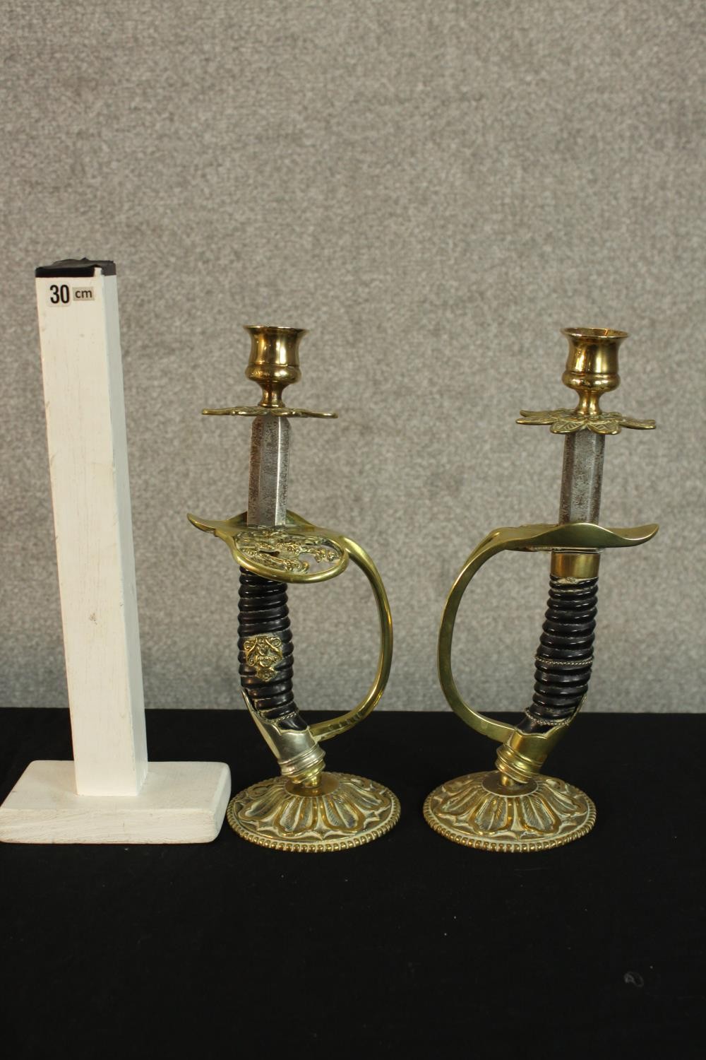 A pair of early 20th century World War I German Officer sword candlesticks raised on brass mounted - Image 2 of 2