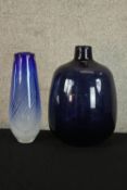 A contemporary, probably Scandinavian blue glass bottle vase together with a mid 20th century blue