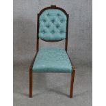 A 19th/early 20th century mahogany framed blue damask button back child's chair raised on sabre
