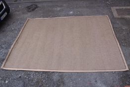 A contemporary beige cotton woven rug. L.375 W.270cm.