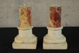 A pair of 19th century carved marble cylindrical marble pillars raised on square plinth bases H.