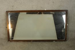 An early 20th century oak framed rectangular wall mirror. H.67 W.132cm.