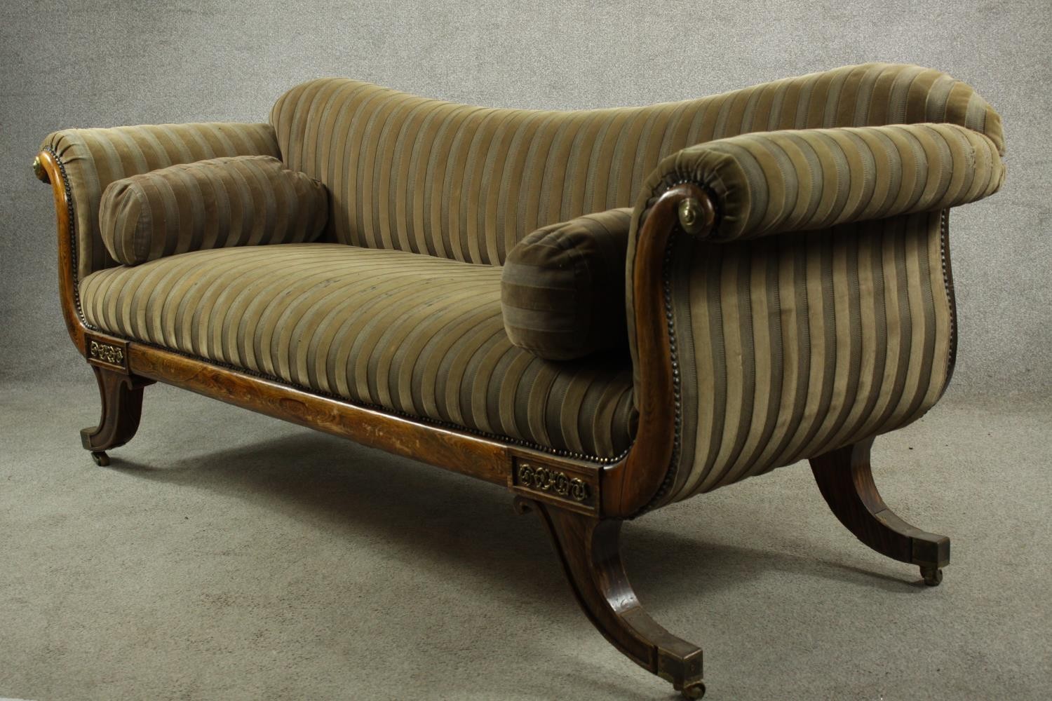 A Regency rosewood framed scroll arm settee upholstered in brown fabric, raised on four outswept - Image 7 of 10