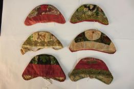 Six various 19th century silk stumpwork skull caps. L.20.cm. (largest)