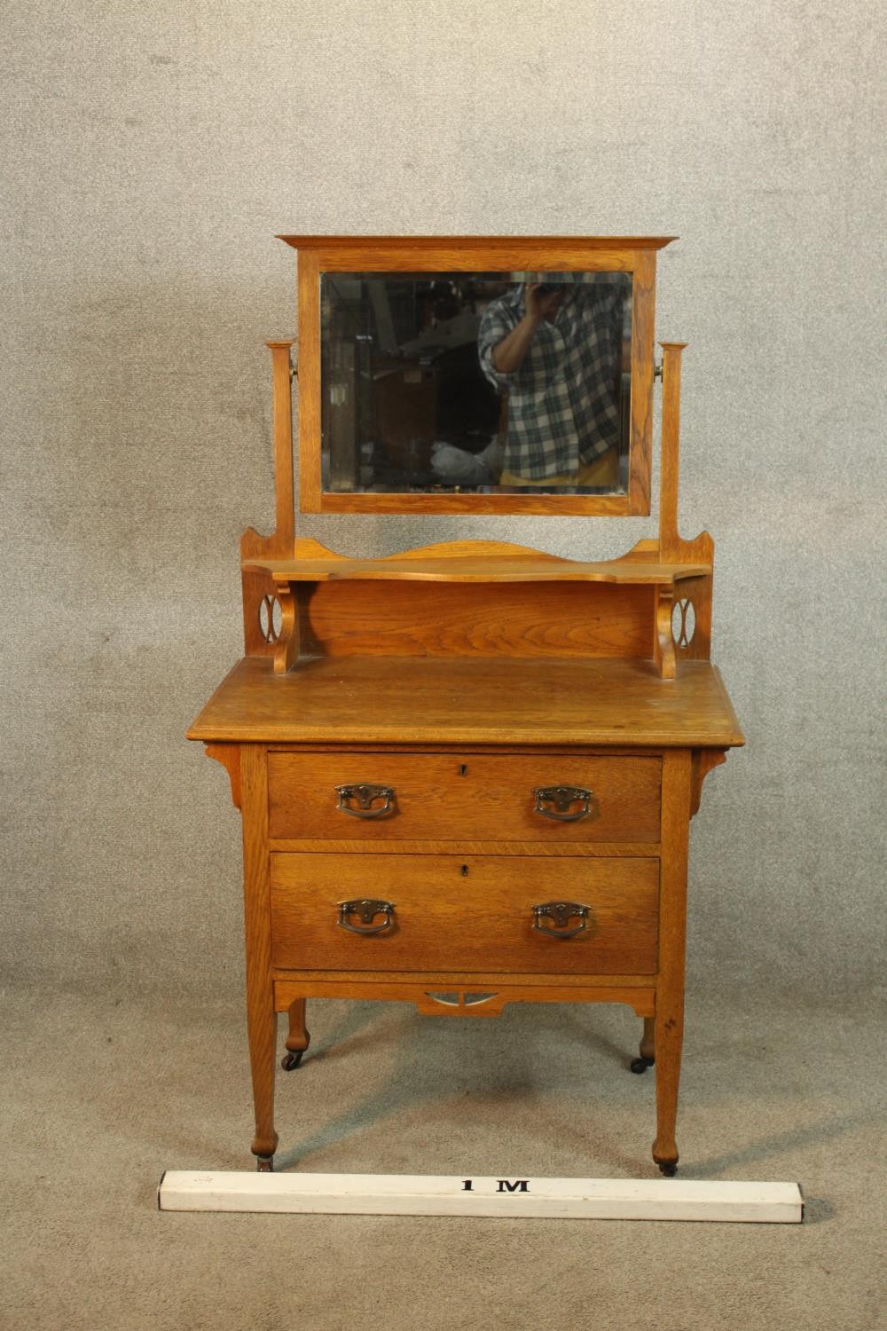 A late 19th/early 20th century mirror back oak two drawer dressing chest raised on turned supports - Image 2 of 4