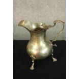 A William IV hallmarked silver pear drop shaped cream jug, London 1830, with 'S' scroll handle