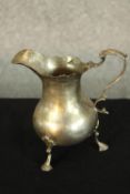 A William IV hallmarked silver pear drop shaped cream jug, London 1830, with 'S' scroll handle