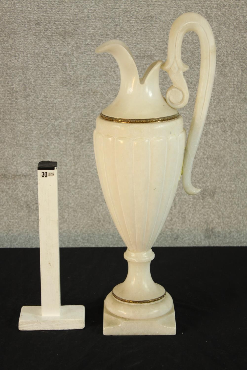 A large 19th/early 20th century carved alabaster ewer, with 'C' scroll handle raised on turned socle - Image 2 of 5