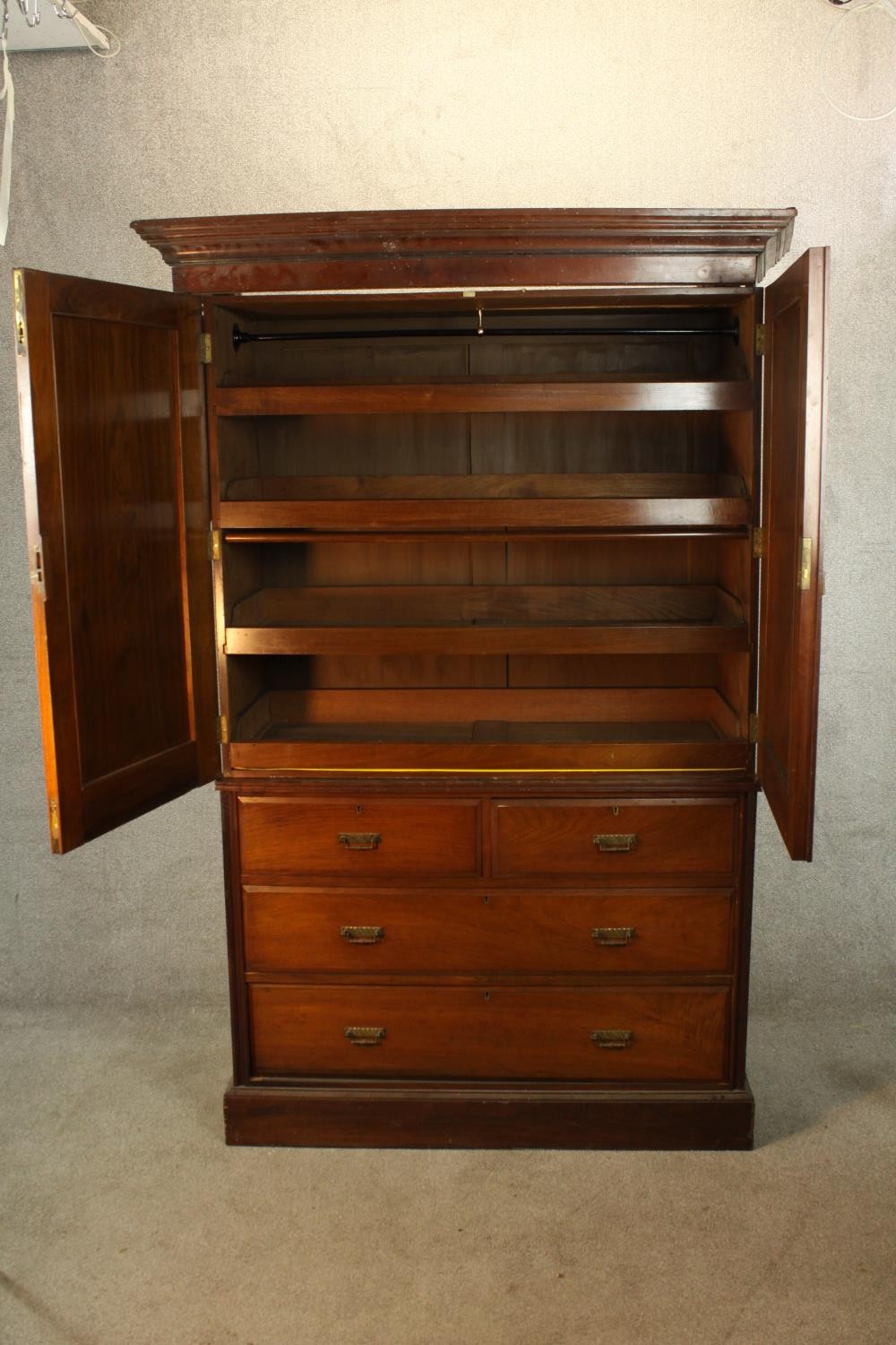 A 19th century mahogany twin door linen press opening to reveal three slides raised on two short - Image 3 of 6