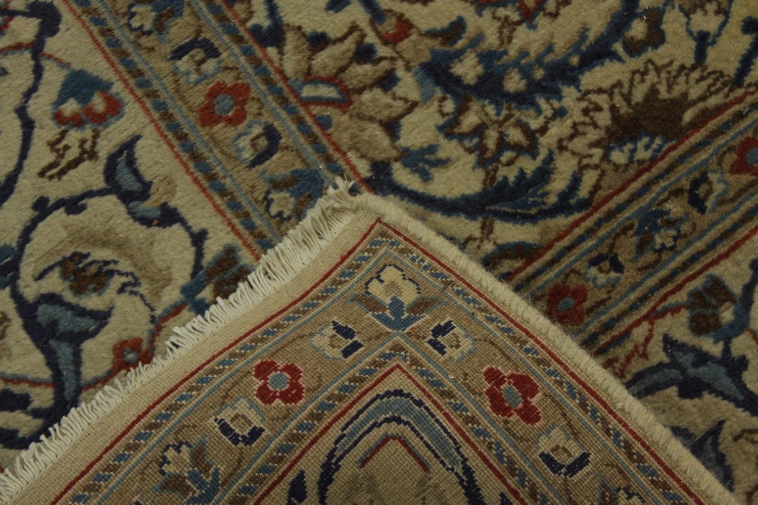 An 20th century Persian woollen carpet with all over floral and scroll decoration. L.203 W.194cm. - Image 5 of 5