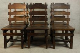 A set of six contemporary oak Gothic style ladder back dining chairs.