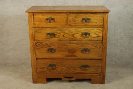 A late 19th/early 20th Art Nouveau style pine chest of two short over three long drawers with