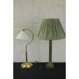 A 20th century brass table lamp, the plain cylindrical column raised on square stepped base together