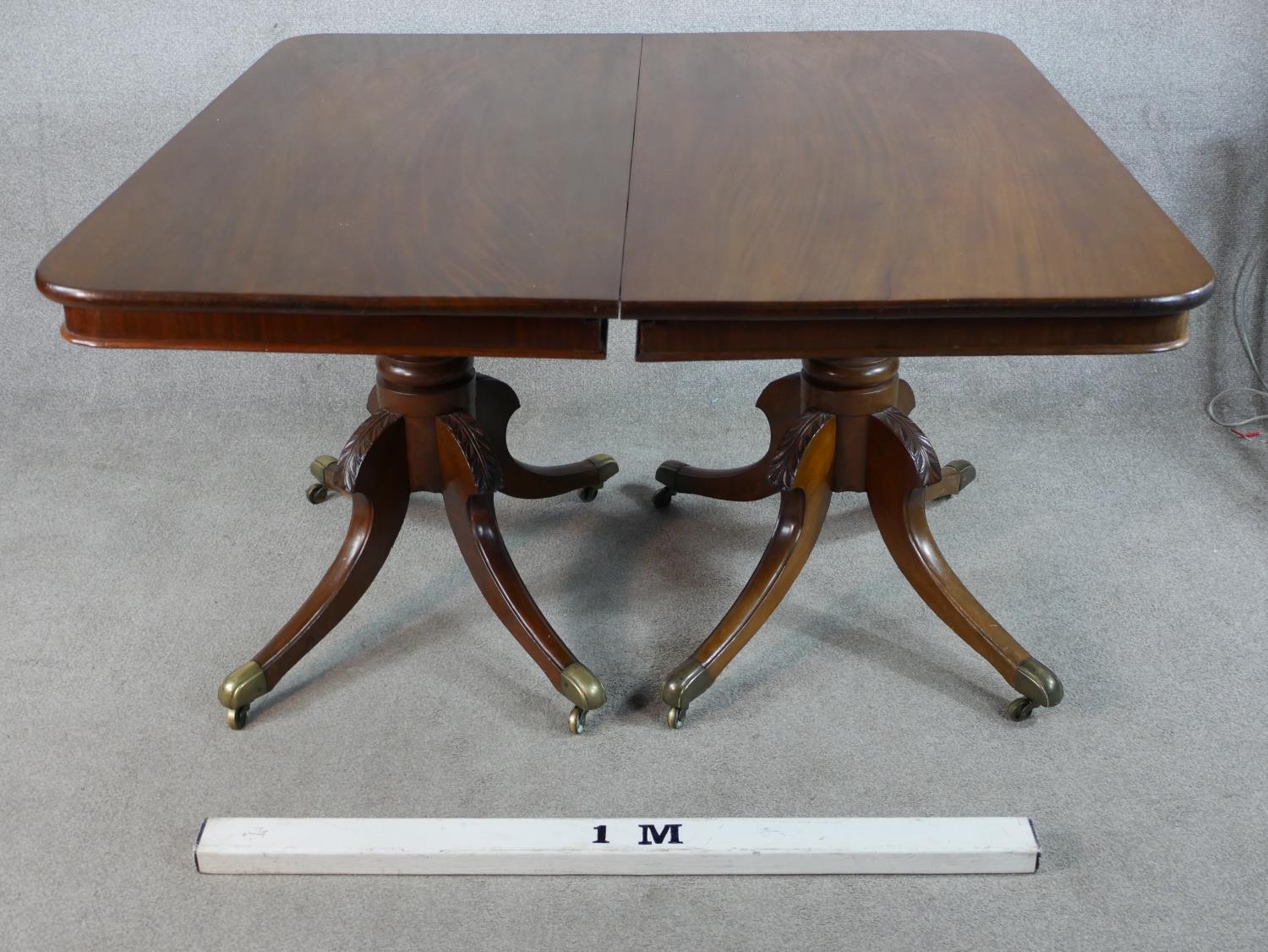 A Regency mahogany twin pedestal extending dining table raised on central turned column each with - Image 3 of 5