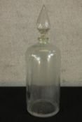 A late 19th/early 20th century clear glass Apothecary jar with teardrop finial. H.65cm.