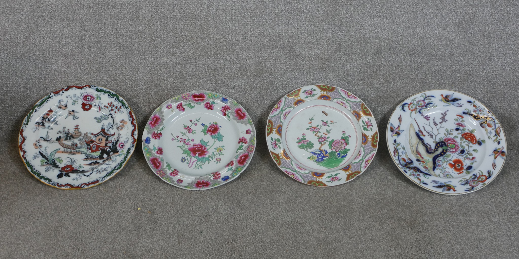 Three early 19th century painted Spode stoneware plates decorated with flowers, together with a 19th
