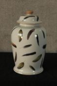 A contemporary Indian Jane white painted porcelain jar and cover decorated with assorted feathers,
