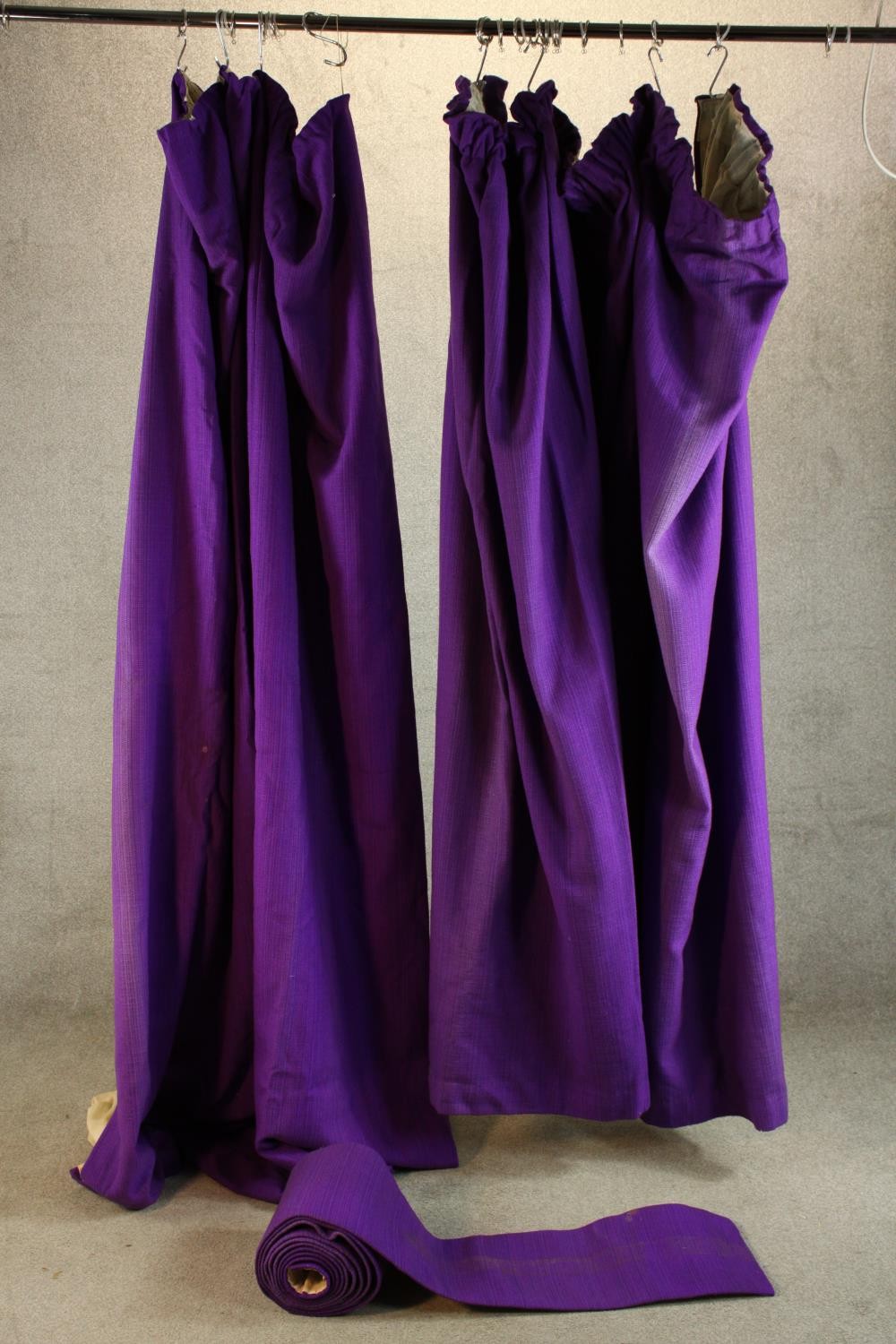 A pair of purple velvet lined curtains. L.250cm. (largest)