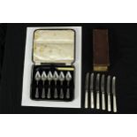 A cased set of six mother of pearl handled knives, together with a cased set of six silver plated
