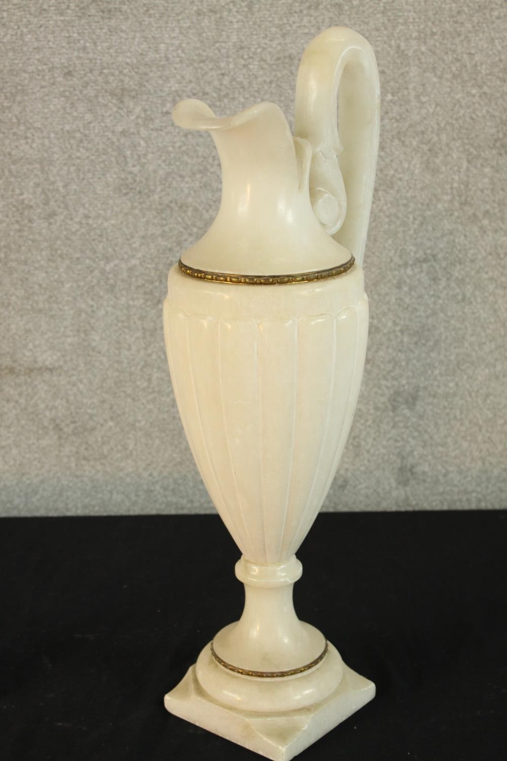 A large 19th/early 20th century carved alabaster ewer, with 'C' scroll handle raised on turned socle - Image 3 of 5