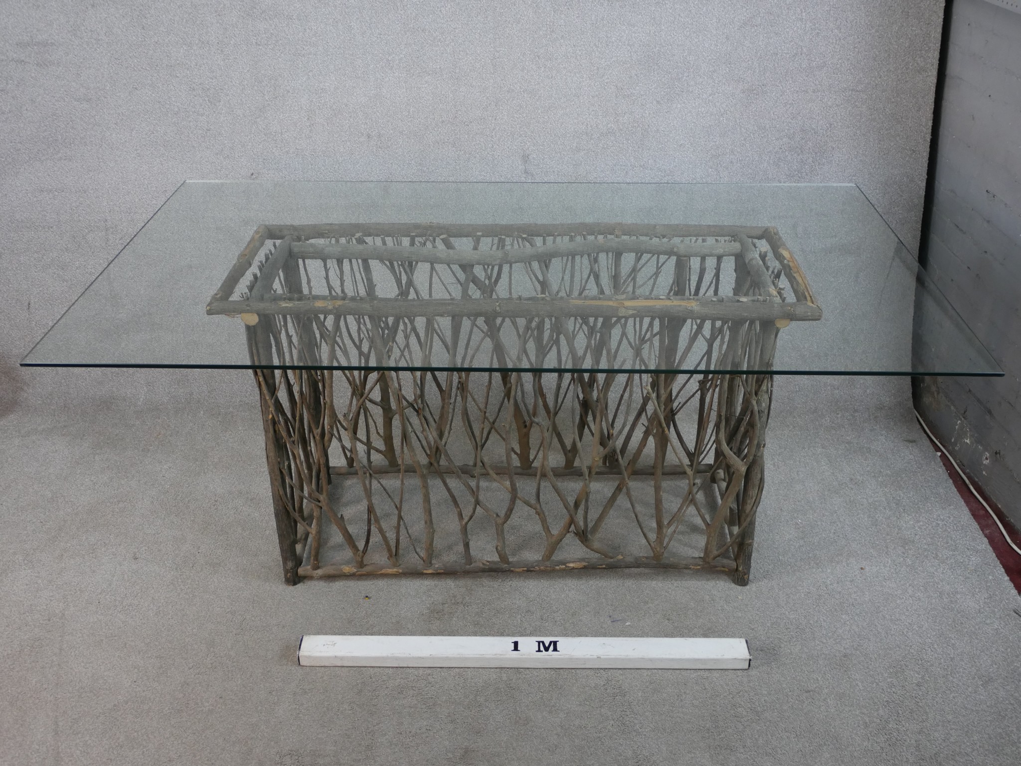 A contemporary glass topped table raised on modernist rectangular twig base. H.77 W.180 D.100cm - Image 3 of 5