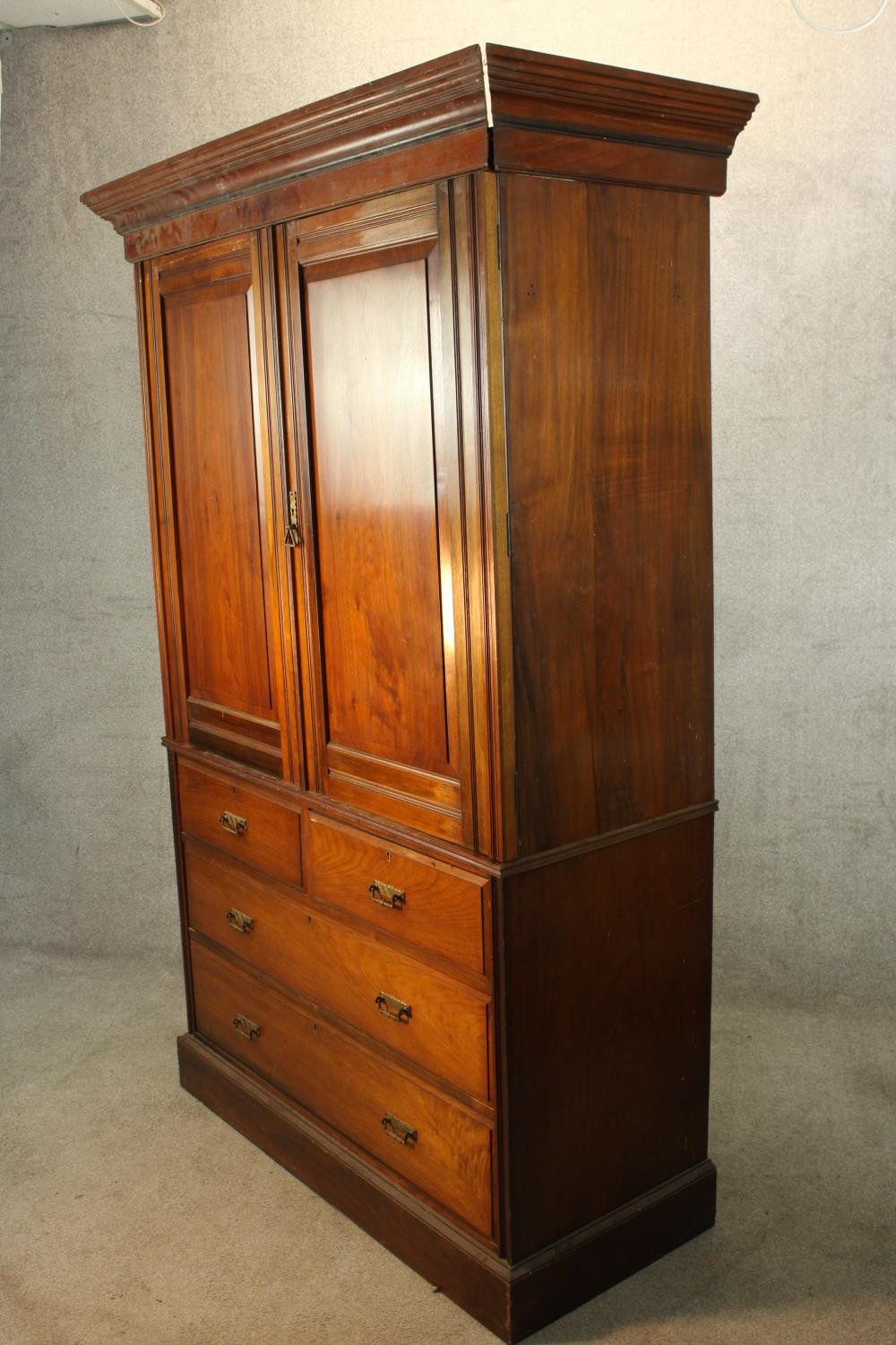 A 19th century mahogany twin door linen press opening to reveal three slides raised on two short - Image 4 of 6